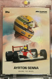 Front of the 2025 Topps McLaren Racing Ayrton Senna Behind the Wheel base card in a magnetic one-touch holder